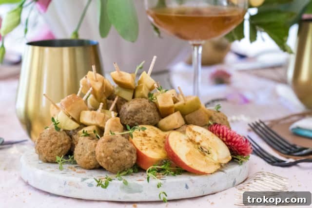 No Oven, No Sweat: 33 Summer Slow Cooker Recipes 4 photo of the Slow Cooker Easy Meatballs garnished with apples by top Houston lifestyle blogger Ashley Rose of Sugar & Cloth