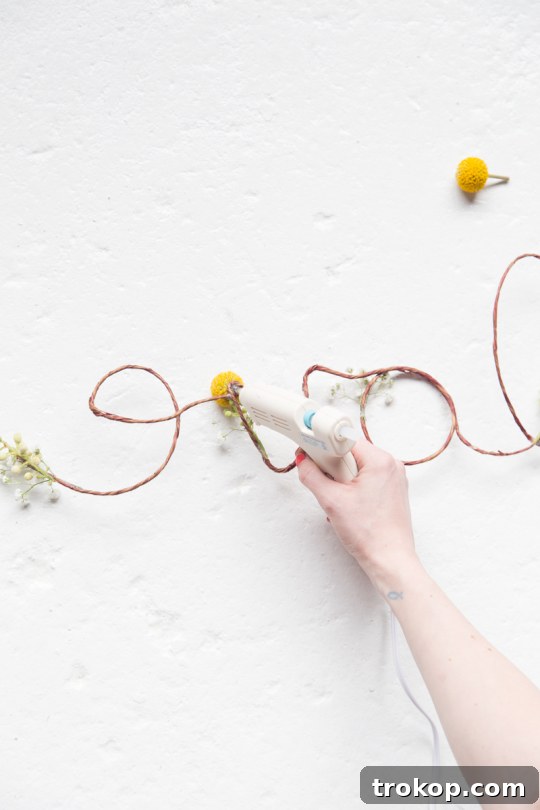 Petal-Perfect Love Craft 6 DIY floral love sign step 3 | Applying hot glue to secure wire joints