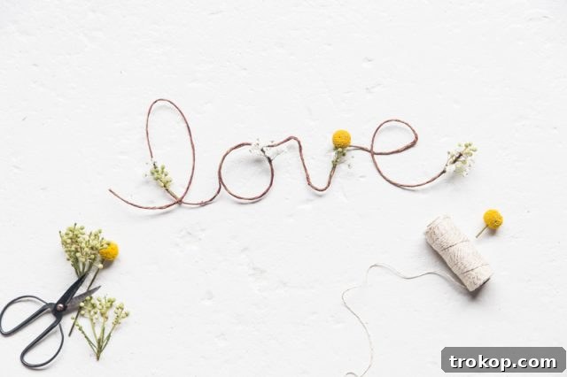Petal-Perfect Love Craft 7 DIY floral love sign step 5 | Gluing fresh flowers onto the wire frame