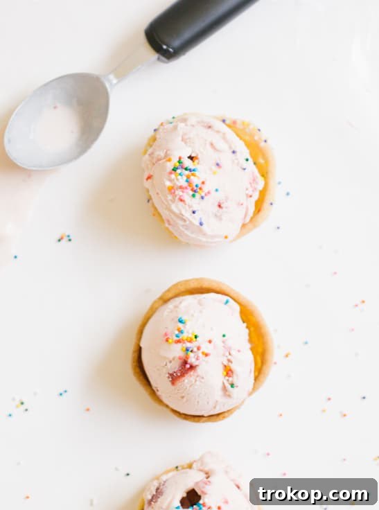 Close-up of a sprinkle-coated cookie cup, showcasing its perfect, sturdy shape and readiness for ice cream.