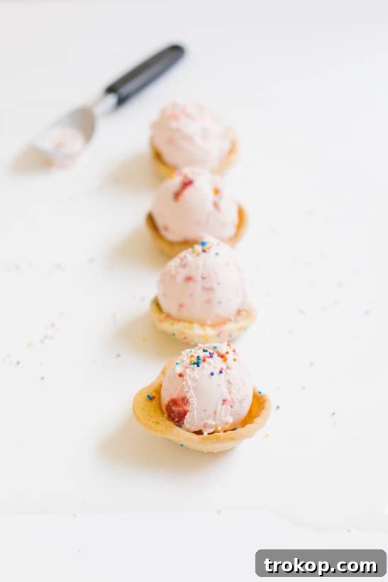 Stacked Ice Cream Cookie Cups, beautifully showcasing their delightful appearance and colorful sprinkles.
