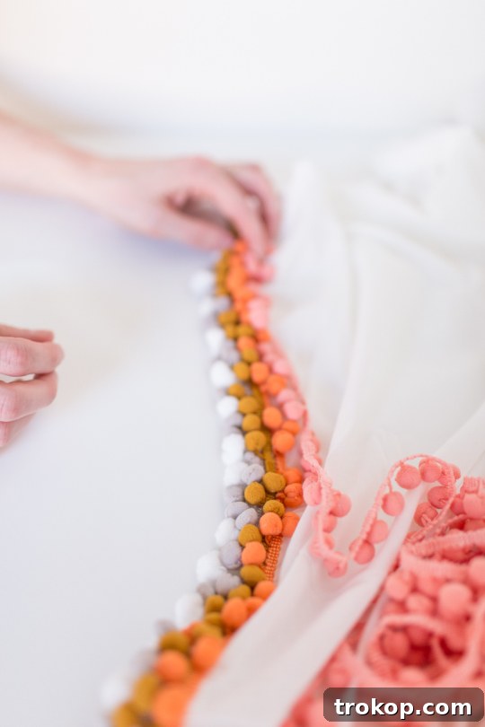Summer Style Spark: DIY Pom Pom Throw Decor Ideas 5 Step 1: Gluing Pom Pom Trim to Throw Blanket