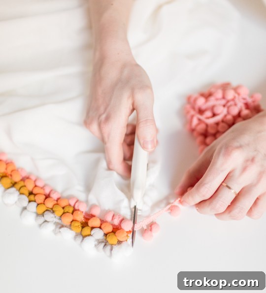 Summer Style Spark: DIY Pom Pom Throw Decor Ideas 6 Step 2: Adding Multiple Rows of Pom Pom Trim