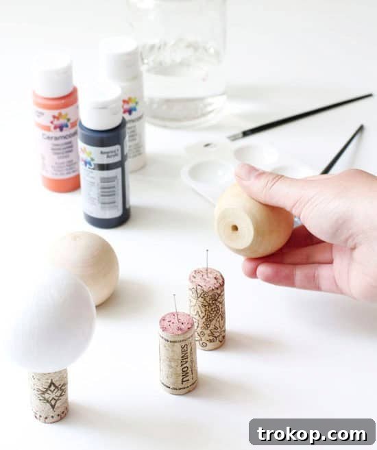 Applying base color to wooden knobs for DIY craft