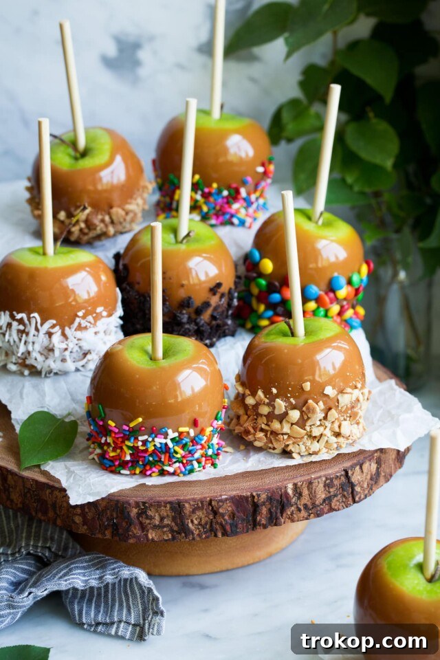 Traditional caramel apples, customizable with toppings like nuts or chocolate drizzle, perfect for Thanksgiving or fall celebrations.