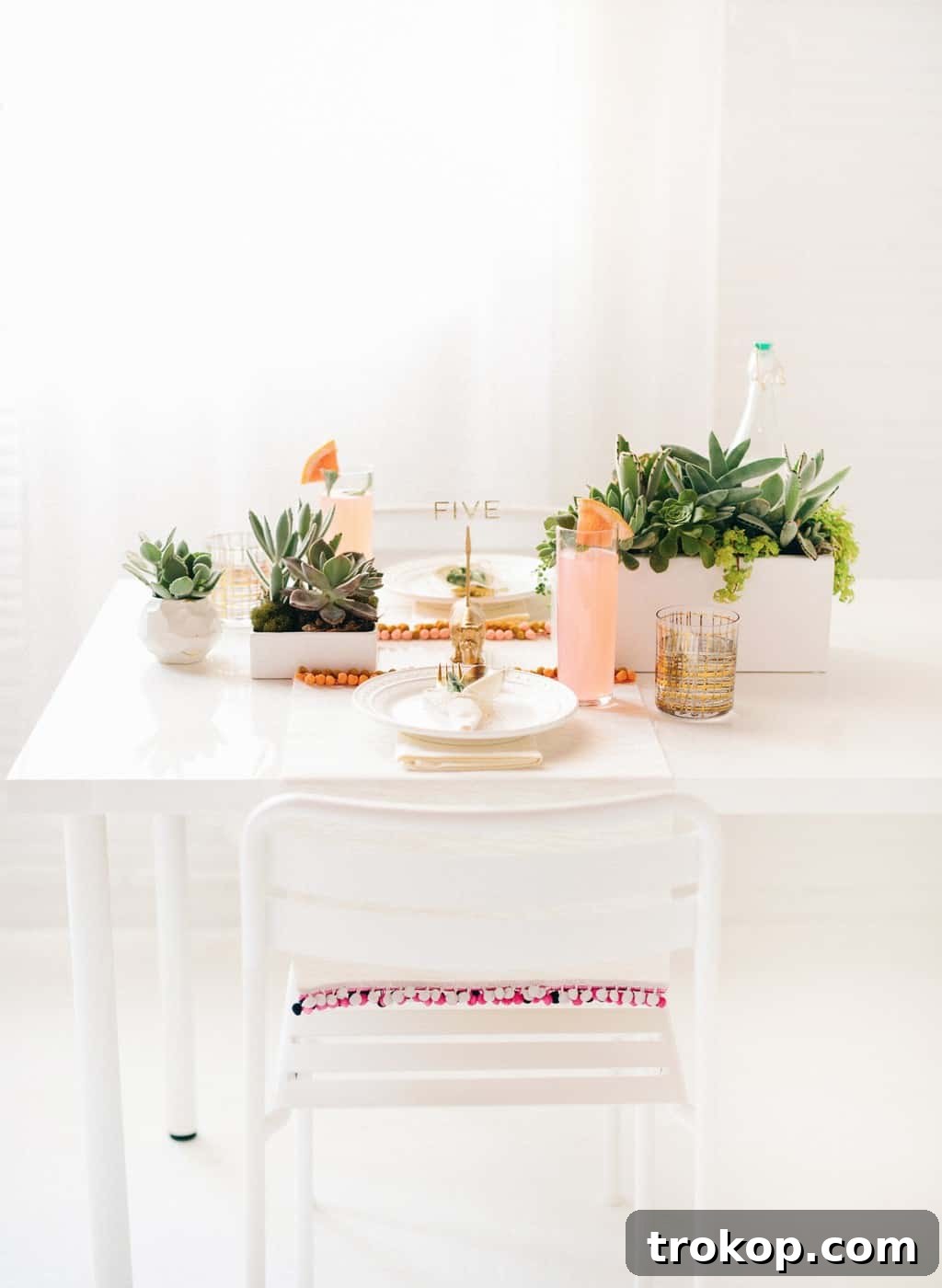 Creative DIY table numbers featuring gold stickers on transparency paper, held by animal memo holders