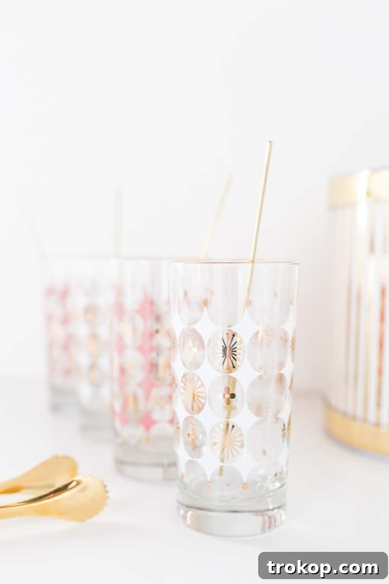DIY reusable gold drink stirrers enhancing a cocktail setup with elegant barware