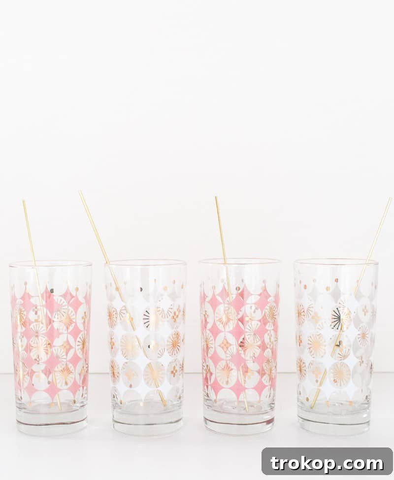 Close-up of DIY gold drink stirrers beautifully displayed in a glass, ready for use