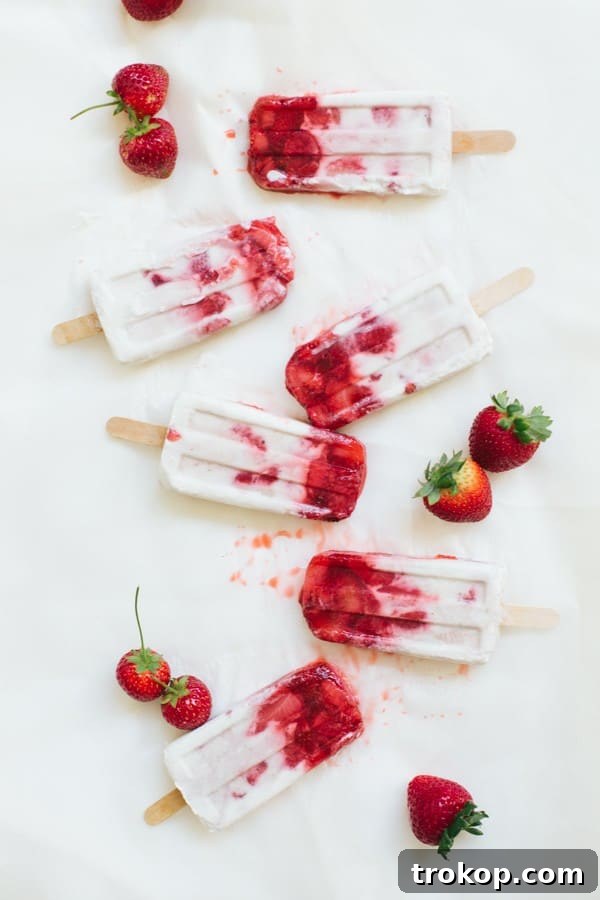 Strawberry Coconut Swirl Pops 2 marbled strawberry coconut popsicle recipe | sugarandcloth.com