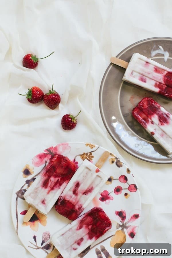 Strawberry Coconut Swirl Pops 9 marbled strawberry coconut popsicle recipe | sugarandcloth.com