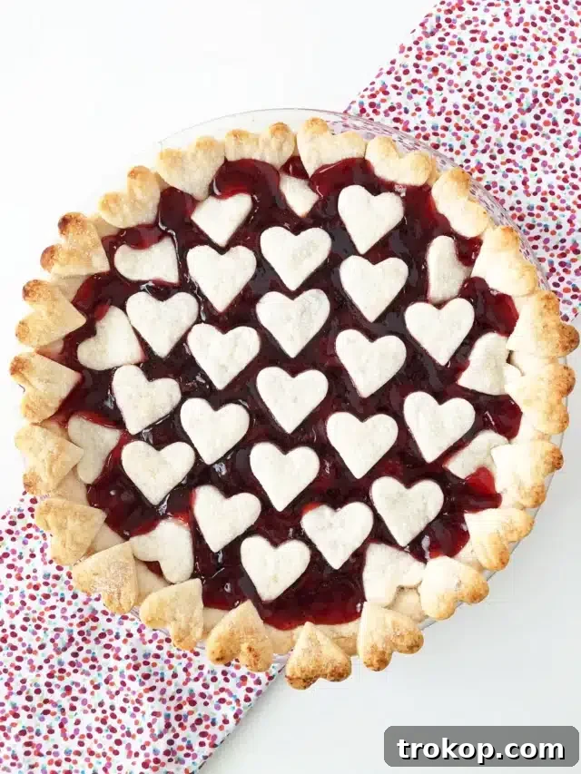 34 Irresistible Valentine's Day Treats 16 A charming Valentine’s Day cherry pie with a delicate crust adorned with mini heart cutouts, filled with sweet cherry, a loving gesture any time of year.