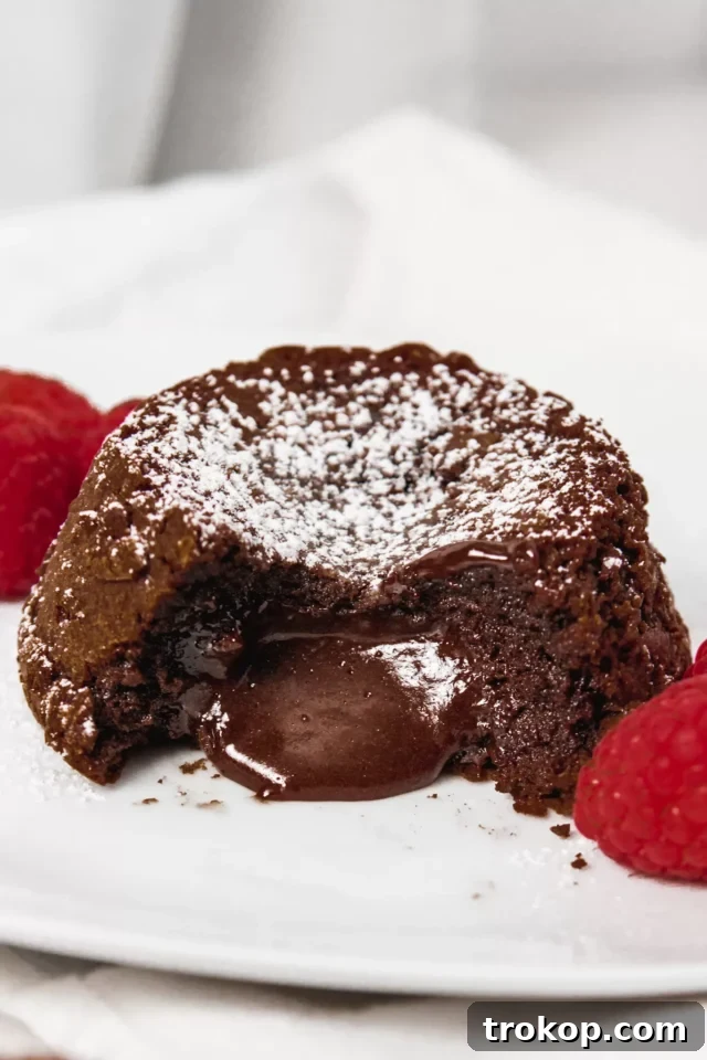 34 Irresistible Valentine's Day Treats 19 Easy and elegant chocolate lava cakes, featuring a warm, gooey molten chocolate center, perfect for a romantic Valentine's Day dessert for two.