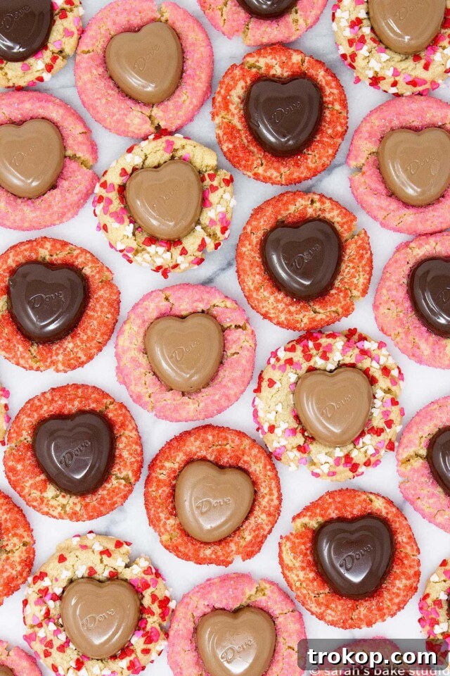34 Irresistible Valentine's Day Treats 24 Festive Valentine peanut butter blossoms, a favorite cookie adorned with pink and red sanding sugar, heart quins, and a creamy Dove Heart Promises chocolate.
