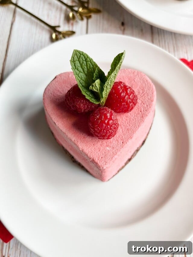 34 Irresistible Valentine's Day Treats 27 A beautiful heart-shaped raspberry mousse served atop a rich, fudgy brownie base, offering a perfect balance of tart and decadent flavors.