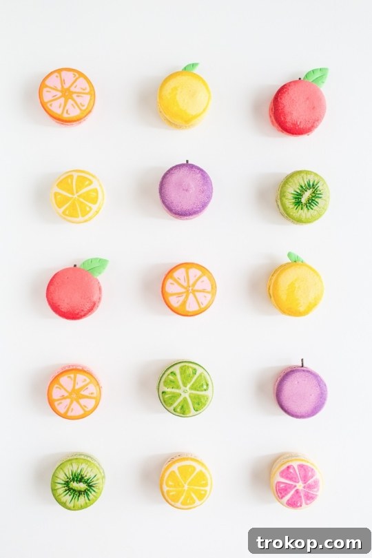 Close-up of freshly decorated DIY fruit macarons.