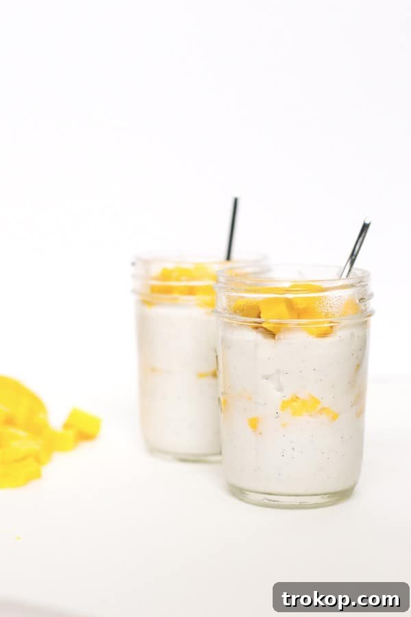 Tropical Mango Coconut Delight 2 Refreshing Mango Coconut Pudding garnished with fresh mango cubes, in a glass jar