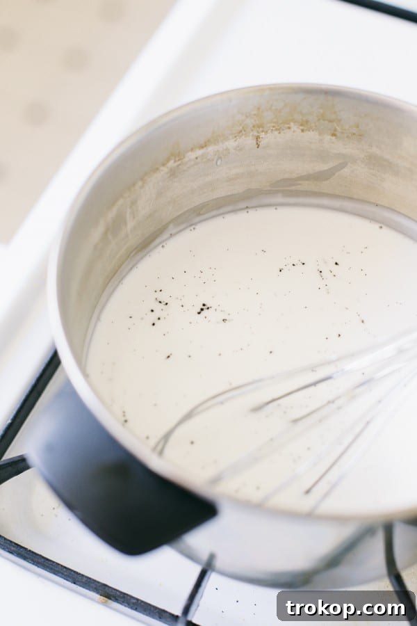 Tropical Mango Coconut Delight 5 Vanilla bean scraped and added to coconut milk in a saucepan, heating gently