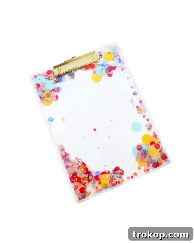 Celebrate every day confetti never boring clear clipboard, a festive desk accessory.