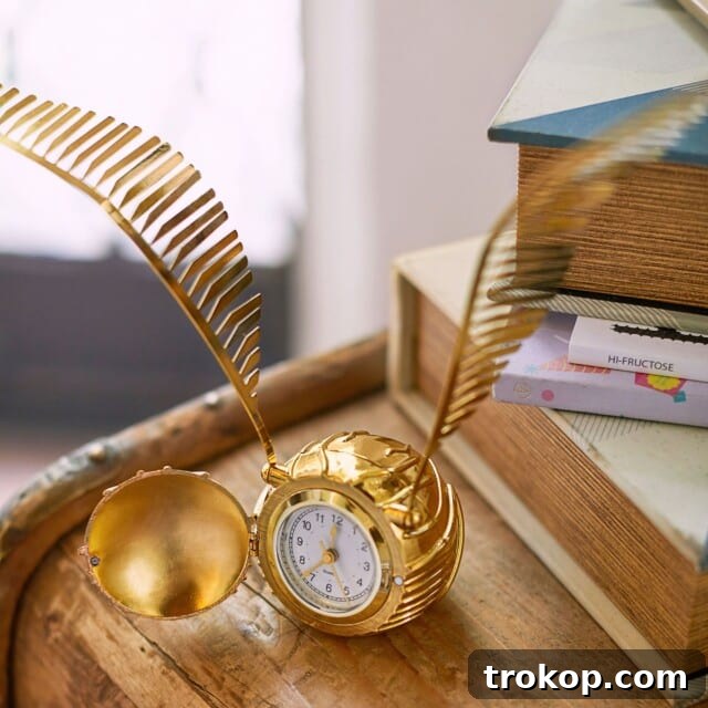 Harry Potter™ Golden Snitch™ Clock, a magical office accessory.