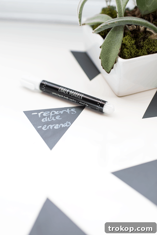 Close-up of DIY geometric chalkboard notes desktop using removable tape