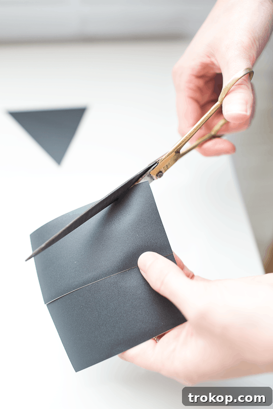 Applying chalkboard tape to a clean desktop surface