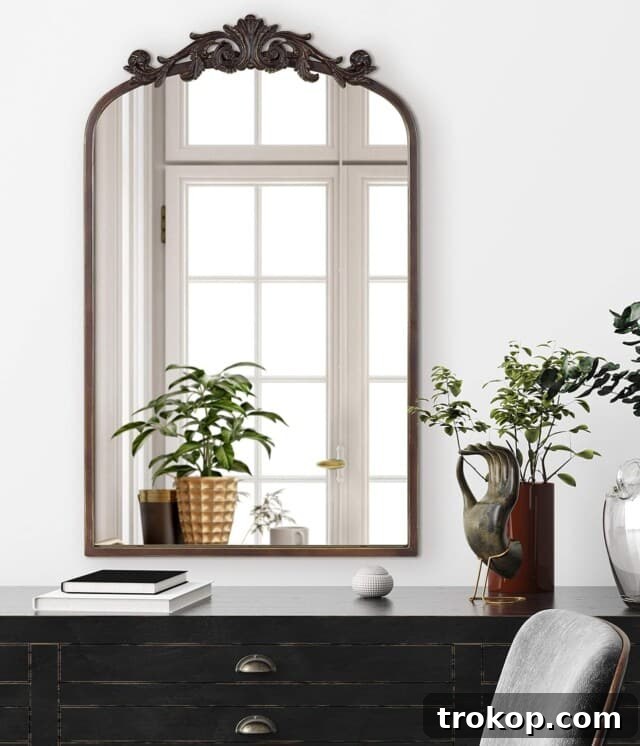 Decorative Wall Mirrors So Stunning, You'll Wonder Where They've Been All Your Life 14 Kate and Laurel Arendahl Traditional Arch Mirror, perfect for vintage-inspired rooms