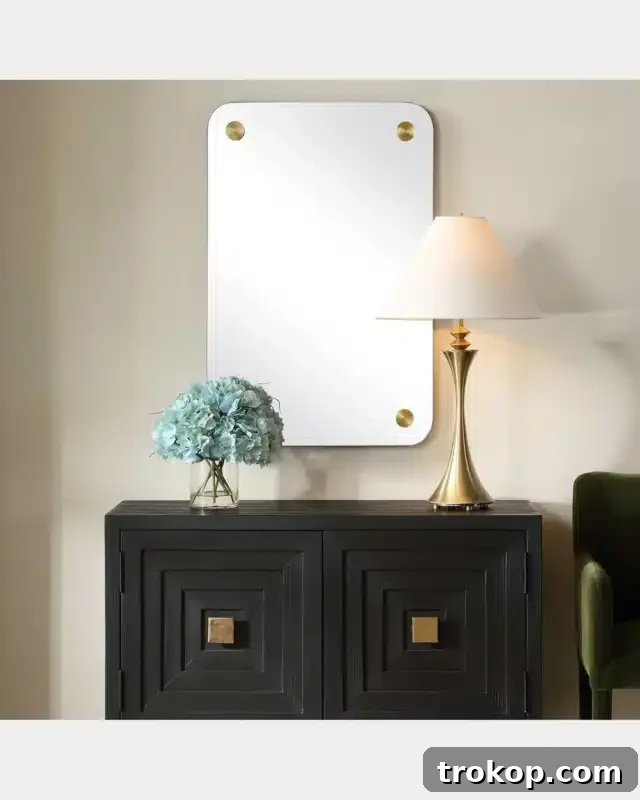 Decorative Wall Mirrors So Stunning, You'll Wonder Where They've Been All Your Life 21 Hamrick 36" Frameless Wall Mirror with brass accents