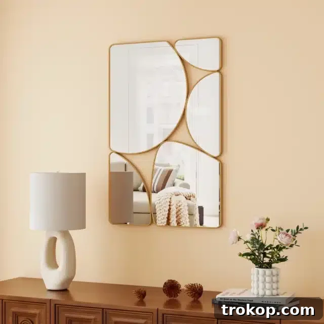 Decorative Wall Mirrors So Stunning, You'll Wonder Where They've Been All Your Life 26 Kaylie Pebble Shaped Metal Wall Mirror, a sculptural art piece