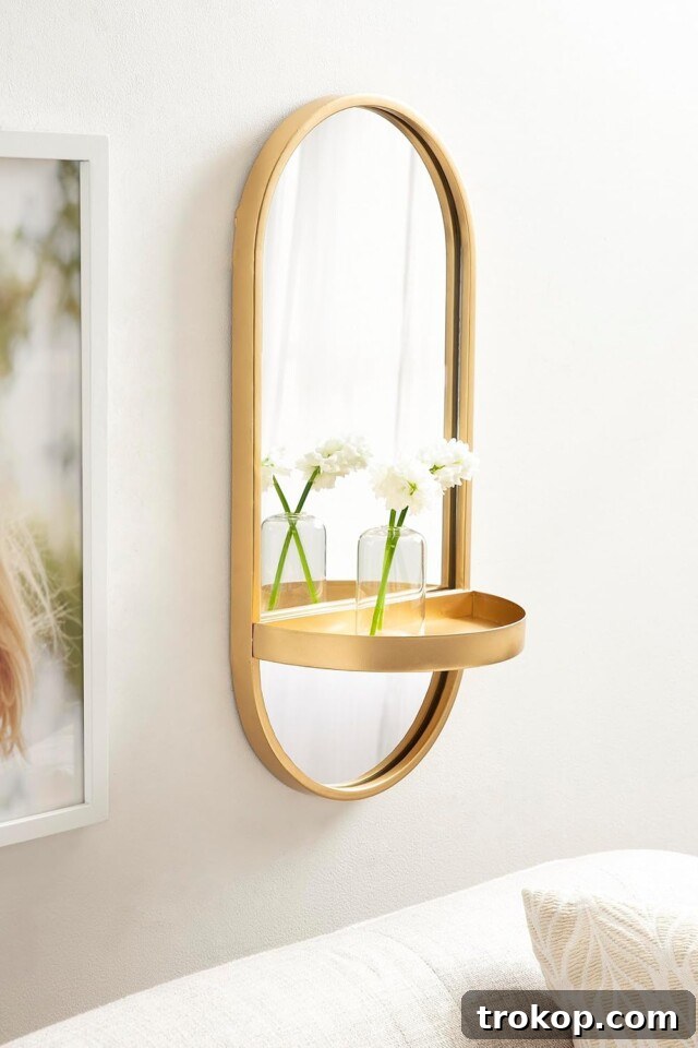 Decorative Wall Mirrors So Stunning, You'll Wonder Where They've Been All Your Life 30 Kate and Laurel Estero Modern Metal Oval Mirror with Rounded Shelf, space-saving decor