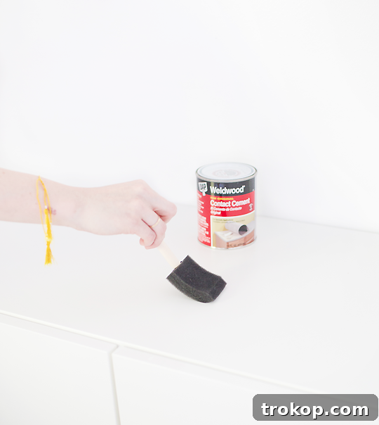 Step-by-step image of applying stain or polyurethane to the wood panel.