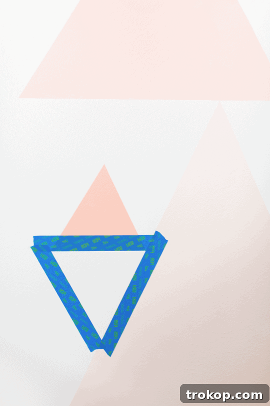 Finished DIY geometric accent wall in a girl's bedroom