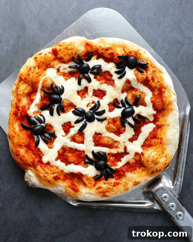 Ghoulishly Good Halloween Party Bites 42 spooktacular spider web pizza for halloween recipes