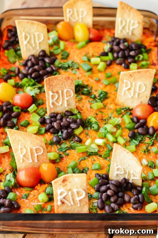 Ghoulishly Good Halloween Party Bites 10 Halloween Taco Dip for Halloween food ideas