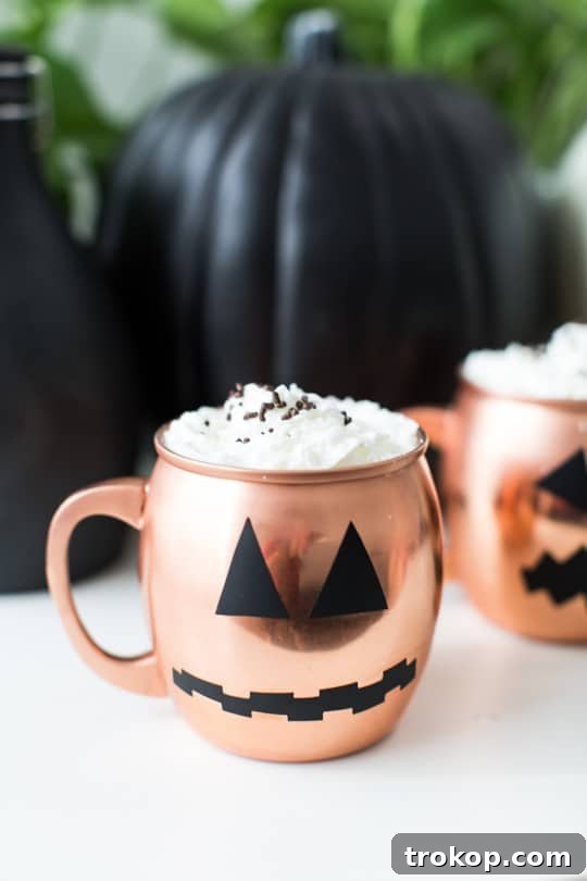 Spookify Your Glasses with Pumpkin Decals 7 Stylized photo of decorated copper mugs for Halloween