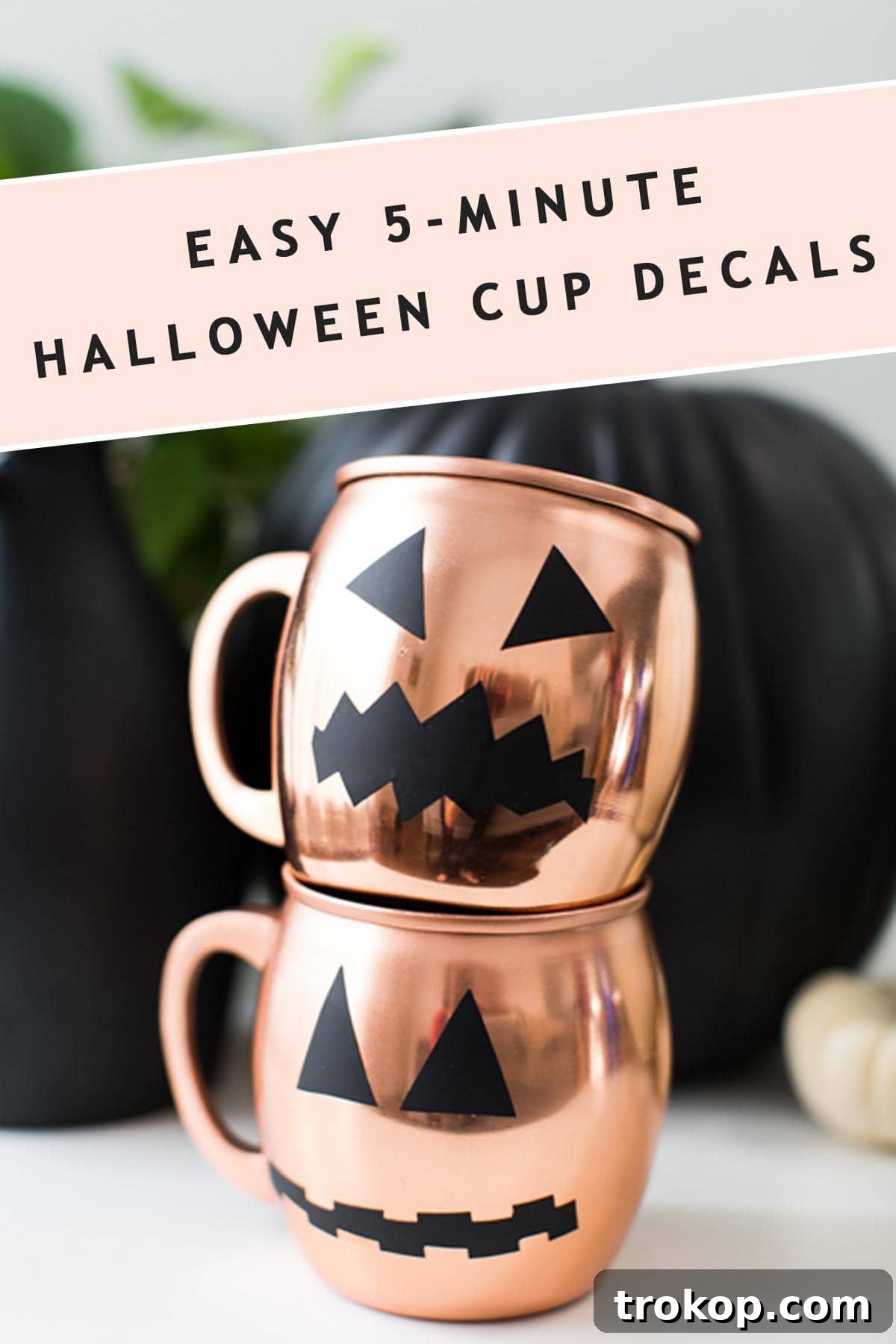Spookify Your Glasses with Pumpkin Decals 10 Photo of two stacked copper mugs with Halloween pumpkin faces