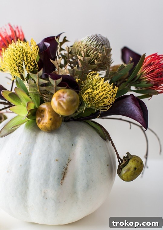 Haunted Harvest Floral Centerpiece 2 Creepy yet elegant DIY Halloween floral centerpiece with dried flowers and a white pumpkin