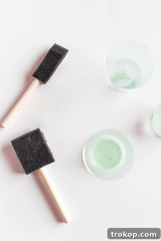 Craft Your Own Watercolor Wall Decor 4 Materials for DIY watercolor wall art: foam brushes, craft paints, and large paper.