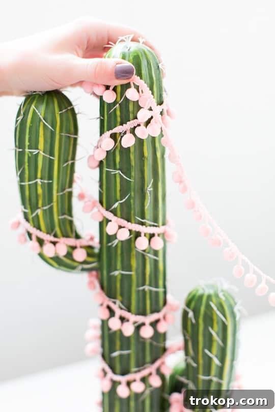 A selection of colorful felt balls and pom pom trim, ideal for decorating a DIY cactus Christmas tree.