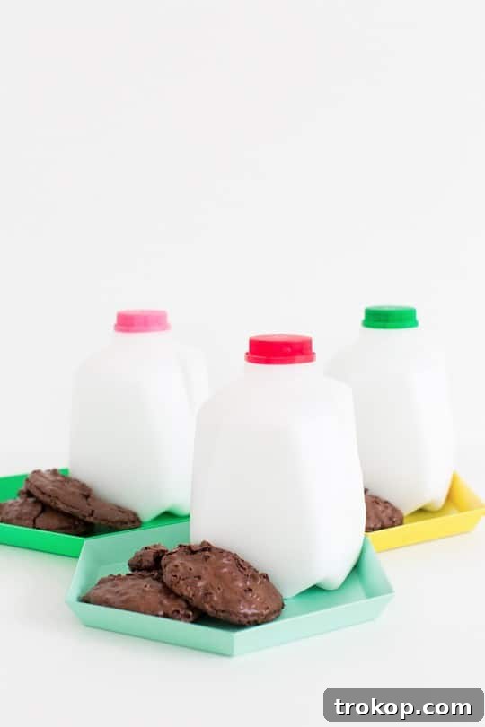 Close-up of a festive DIY milk and cookie party favor with a mini jug and cookie