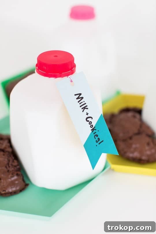 DIY milk and cookie party favors with festive straws on a tray