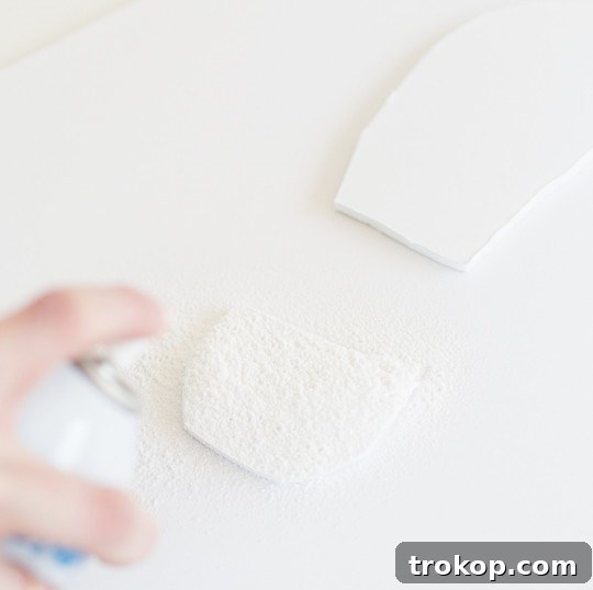 Craft Your Own Santa Footprints 7 Applying fake snow to DIY Santa footprints