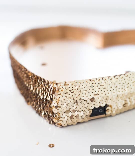 DIY Sparkling Heart Marquee 7 Adding sequin trim to the edge of the heart