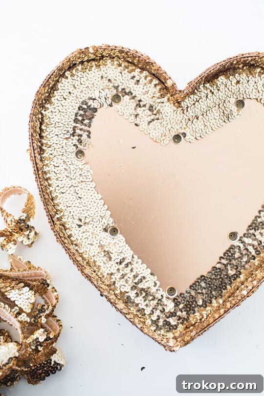 DIY Sparkling Heart Marquee 10 Filling in the heart with sequin trim