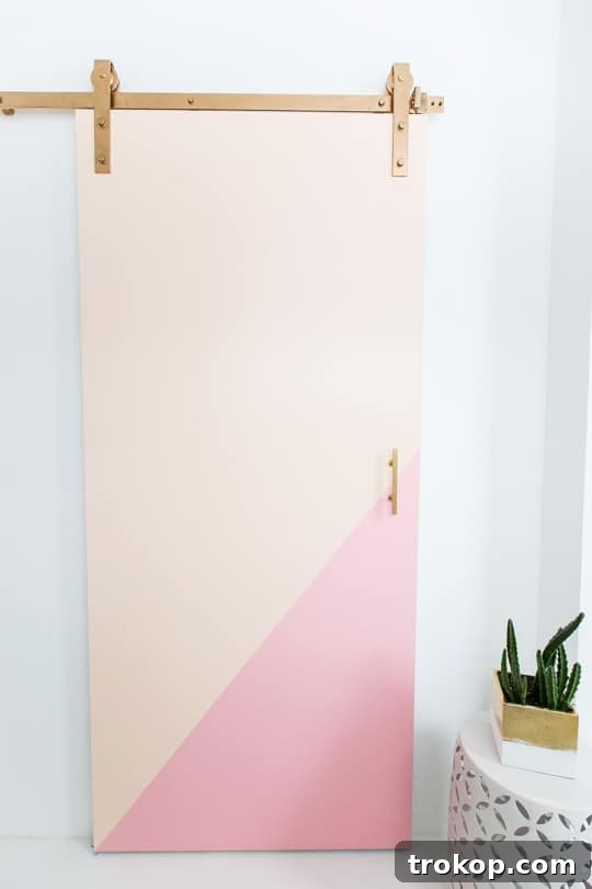 Final view of the installed color block barn door, enhancing the studio space.