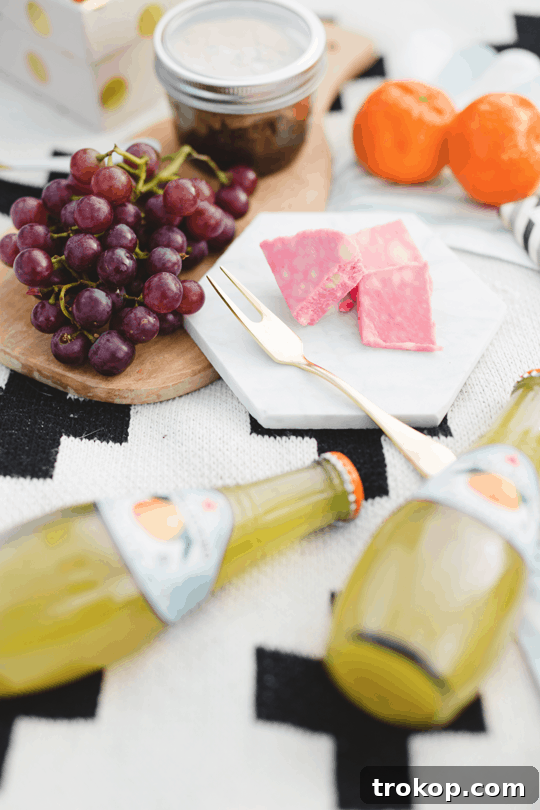 Daytime Adventures for Two 9 Close-up of the picnic spread with a focus on fresh grapes, tangerines, and cheese, artfully presented.