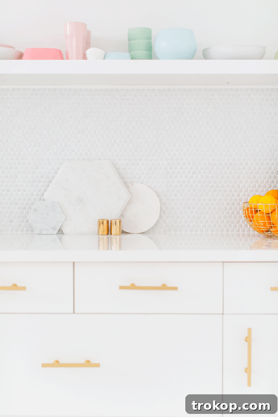 Inspiring design of the Sugar & Cloth Studio Kitchenette Bright and airy Sugar & Cloth Studio Kitchenette with a focus on white, gold, and green accents