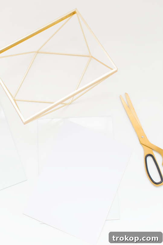 Craft Your Own Erasable Canvas 4 A hand writing on the glass surface of the DIY Desktop Dry Erase Board, showcasing its practical use.