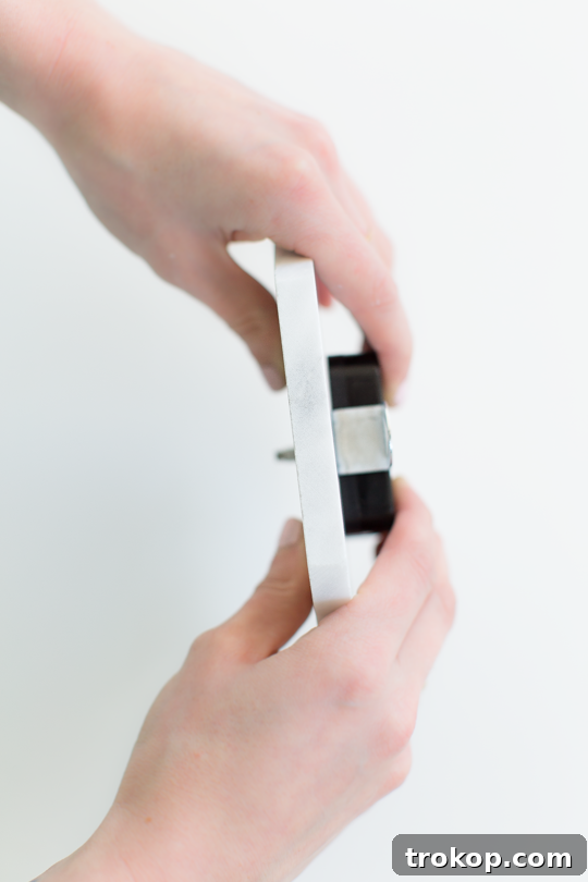 Handcrafted Marble Tabletop Timepiece 7 Applying super glue to secure clock mechanism to marble tile