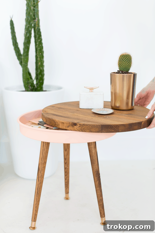 Beautifully crafted DIY Mid Century Modern Side Table with storage, featuring tapered wooden legs and a vibrant pink base.