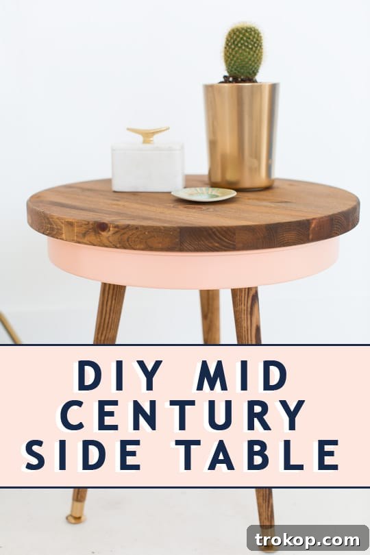 Stylishly decorated living room featuring a modern DIY Mid Century Side Table by Ashley Rose of Sugar & Cloth.